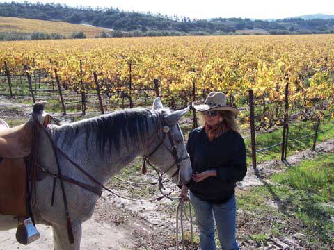 Sue Roya and Lacey in the vineyard